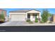 Charming single-story home featuring a two-car garage and well-maintained landscaping at 19365 N Pietra Dr, Maricopa, AZ 85138