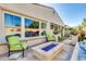 Beautiful backyard patio with comfortable seating, a fire pit, and manicured landscaping for a tranquil outdoor escape at 1952 W Yellowstone Way, Chandler, AZ 85248