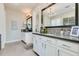 Bathroom showcasing double vanity sinks with sleek cabinets and large mirror at 1952 W Yellowstone Way, Chandler, AZ 85248
