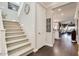 Inviting entryway with staircase, wood floors, neutral colors, and a view of the living spaces at 1952 W Yellowstone Way, Chandler, AZ 85248