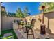 Cozy outdoor seating area with a grill, high chairs, and patio heater for year-round comfort at 1952 W Yellowstone Way, Chandler, AZ 85248