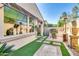 Outdoor seating area with a grill, high chairs, and patio heater for year-round comfort and outdoor entertainment at 1952 W Yellowstone Way, Chandler, AZ 85248