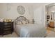 Bedroom showcasing a decorated bed and dresser, complemented by a ballerina statue at 1958 W Legends Way, Anthem, AZ 85086