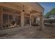 Inviting covered patio with ceiling fans, flagstone flooring, and panoramic backyard views at 1958 W Legends Way, Anthem, AZ 85086