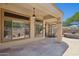Inviting covered patio with ceiling fans, flagstone flooring, and panoramic backyard views at 1958 W Legends Way, Anthem, AZ 85086