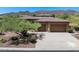 Charming home with well-manicured desert landscaping and a three car garage at 1958 W Legends Way, Anthem, AZ 85086