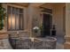 Charming front porch with outdoor seating, plants and stylish decor at 1958 W Legends Way, Anthem, AZ 85086