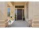 Charming front porch with decorative lanterns and a secure brown steel screen door at 1958 W Legends Way, Anthem, AZ 85086