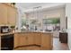 Spacious kitchen with a large island, granite countertops, and views of the backyard at 1958 W Legends Way, Anthem, AZ 85086