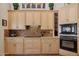 Well-equipped kitchen with built in microwave and oven, ample counter space, and overhead cabinets at 1958 W Legends Way, Anthem, AZ 85086