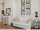 Relaxing living room featuring a sofa, stylish decor, and a decorative bar cart at 1958 W Legends Way, Anthem, AZ 85086