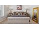 Elegant main bedroom with decorative lamps and cozy bedding at 1958 W Legends Way, Anthem, AZ 85086