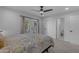 Cozy bedroom featuring neutral decor, an adjacent bathroom, and access to natural light at 2018 E Balboa Dr, Tempe, AZ 85282