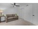 This room features a comfortable sofa, a ceiling fan, and built in storage at 2018 E Balboa Dr, Tempe, AZ 85282