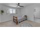 A cozy bedroom features a bed, ceiling fan, and an en suite bathroom at 2018 E Balboa Dr, Tempe, AZ 85282