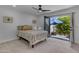 A bright bedroom featuring an outdoor patio and a comfortable bed with decorative pillows at 2018 E Balboa Dr, Tempe, AZ 85282