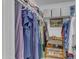 A well-organized closet with clothing racks, storage bins, and shoe shelves at 2018 E Balboa Dr, Tempe, AZ 85282