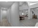 Spacious hallway that opens to a dining room with a unique window at 2018 E Balboa Dr, Tempe, AZ 85282