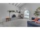 Cozy living room featuring fireplace, accent furniture, high ceiling and view of the backyard pool at 2018 E Balboa Dr, Tempe, AZ 85282