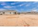 Open backyard with covered seating area, barbecue space, and blank canvas, ready to be transformed at 203 S 190Th Ave, Buckeye, AZ 85326