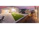 Beautiful backyard with pavers, turf squares, a gazebo with seating, and a privacy wall at 203 S 190Th Ave, Buckeye, AZ 85326