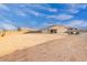 Wide backyard featuring a covered seating area, barbecue space, and an open area for customization at 203 S 190Th Ave, Buckeye, AZ 85326