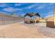 Backyard featuring a covered seating area, brick pavers, and a spacious open area at 203 S 190Th Ave, Buckeye, AZ 85326