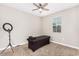 Bright bedroom features ceiling fan, carpet, and a window with neutral colored walls at 203 S 190Th Ave, Buckeye, AZ 85326