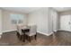 Formal dining room featuring wood-look tile floors and modern furniture at 203 S 190Th Ave, Buckeye, AZ 85326