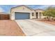 Charming single-story home featuring a two-car garage, neutral stucco and xeriscaping for low maintenance at 203 S 190Th Ave, Buckeye, AZ 85326