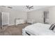Comfortable main bedroom featuring a crib and carpeted floors at 203 S 190Th Ave, Buckeye, AZ 85326