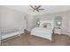 Large main bedroom featuring a ceiling fan and a crib, with natural lighting at 203 S 190Th Ave, Buckeye, AZ 85326