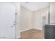 This mud room has tiled floors and joins the garage access door to the laundry room at 203 S 190Th Ave, Buckeye, AZ 85326