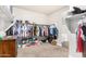 Spacious walk-in closet with organized shelving, hanging clothes, and shoe storage at 203 S 190Th Ave, Buckeye, AZ 85326