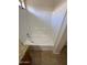 Bathroom features a large soaking tub with white tile surround at 21192 N 80Th Ln, Peoria, AZ 85382