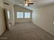 The primary bedroom features a ceiling fan and lots of natural light at 21192 N 80Th Ln, Peoria, AZ 85382
