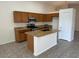 Well-equipped kitchen features granite countertops, wood cabinetry, and a functional center island at 21192 N 80Th Ln, Peoria, AZ 85382