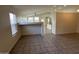 Open floor plan showing tile flooring throughout living area and bright natural light at 21192 N 80Th Ln, Peoria, AZ 85382