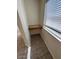 Functional office nook featuring a built-in granite desk and a window providing natural lighting at 21192 N 80Th Ln, Peoria, AZ 85382