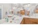 Bright bathroom with double sinks, white countertop, wooden cabinets, and a large mirror that gives a spacious feel at 2150 W Alameda Rd # 1424, Phoenix, AZ 85085