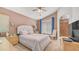 Comfortable bedroom with brown walls, a queen bed, and neutral decor at 2150 W Alameda Rd # 1424, Phoenix, AZ 85085