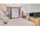 Bright bedroom with a queen bed, natural lighting, and en suite bathroom at 2150 W Alameda Rd # 1424, Phoenix, AZ 85085