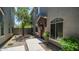 Charming townhome entrance featuring well-kept landscaping and a welcoming front door at 2150 W Alameda Rd # 1424, Phoenix, AZ 85085