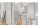 Hallway with neutral paint, hardwood floors, and white doors at 2150 W Alameda Rd # 1424, Phoenix, AZ 85085