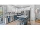 Stylish kitchen featuring two-tone cabinets, a functional island, and stainless steel appliances at 2150 W Alameda Rd # 1424, Phoenix, AZ 85085