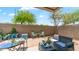 Charming backyard patio featuring comfortable seating, decorative accents, and a cozy atmosphere for outdoor enjoyment at 2150 W Alameda Rd # 1424, Phoenix, AZ 85085