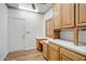 Charming kitchen with white countertops, wood cabinets, and stainless steel appliances at 225 S Pioneer -- # 36, Mesa, AZ 85204