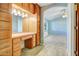 A serene main bedroom with walk-in closet, vanity and access to a well-lit ensuite at 225 S Pioneer -- # 36, Mesa, AZ 85204