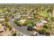 Aerial shot of the neighborhood showcasing mature trees, pools, and well-maintained streets at 23240 N Country Club Trl, Scottsdale, AZ 85255