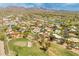 Expansive aerial view of the golf course community with lush landscaping and mountain views at 23240 N Country Club Trl, Scottsdale, AZ 85255